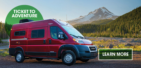 Red Winnebago Solis Pocket Parked in picturesque mountainscape. Learn More.